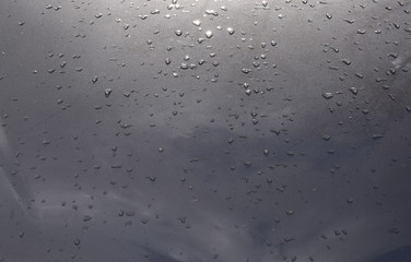 Detail of a polished floor with water drops
