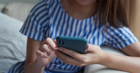 Woman use of mobile phone at home
