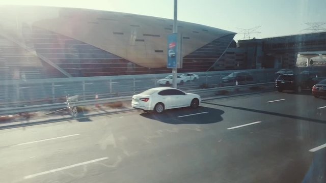 United Arab Emirates, Dubai - February 5, 2019 : Urban roads through the front window of the car, road traffic in Dubai cityscape. 