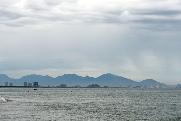 Seascape on the coast of Vietnam with a view of the mountains, boats and the city of Da Nang. Hoi An, Vietnam