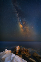 Milky way rising above White Stones beach in Limassol, Cyprus