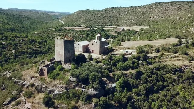 Aerial view of the Riner castle, church and tower near Solsona, Catalonia, Spain, Europe.
Dolly show pull back wide angle