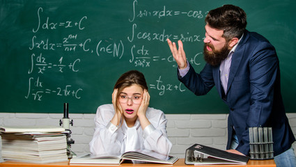 Man unhappy communicating. Conflict situation. School conflict. Demanding lecturer. School...
