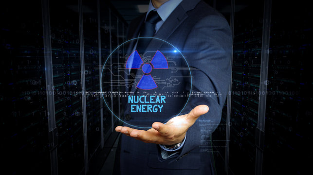 Businessman touch screen with nuclear energy symbol hologram - Powered by Adobe