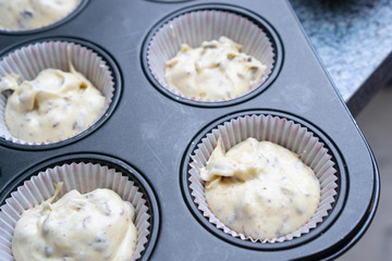 Freshly made muffin dough in liners