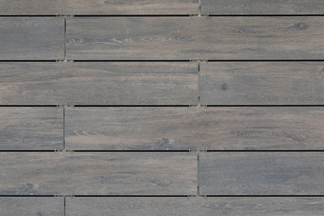 Elevated view of pale grey wooden planks stiffed with each other