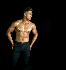 Naklejka premium Asian muscle men posing muscle front on the black background. Body gym big chest and shoulder and bicep. Healthy fitness body type.