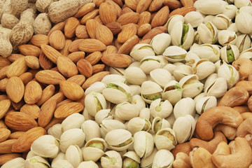 Nuts background, pistachio, almond, peanut and cashew nuts