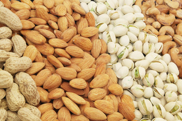 Nuts background, pistachio, almond, peanut and cashew nuts