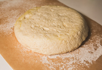 Yeast dough on the table. Baking concept. Cooking ideas. Homemade food. Knead flour and water.