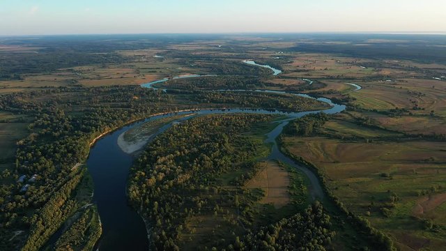 Aerial view of beautiful flood-meadow and river flood.Flying above beautiful Desna river when the river is full of water at spring at National Nature Park in Chernihiv Oblast, Ukraine.