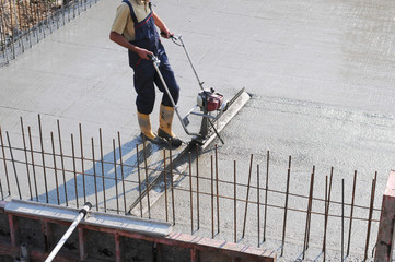 Concrete pouring during commercial concreting floors of buildings in construction