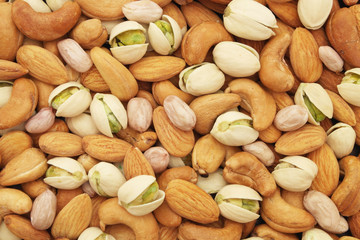 Nuts background, pistachio, almond, peanut and cashew nuts