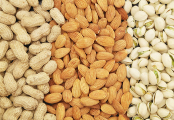 Pistachio, almond and peanut nuts as background