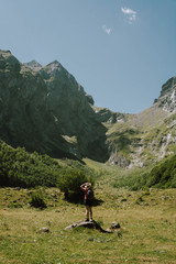 Fototapeta na wymiar A woman hiking in the Aran valley in Spain, exactly in Artiga de Lin,