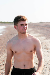 Shirtless on a beach