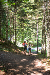 Obraz premium A woman hiking in the Aran valley in Spain, exactly in Artiga de Lin,