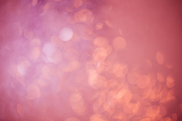 Pink shiny glitter holiday beautiful abstract blur bokeh background.