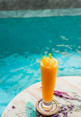 Orange juice, shake and place beside the pool