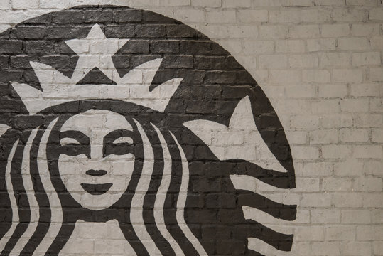 Bangkok, Thailand - August 11, 2018 : Starbucks coffee logo on the wall in front of the shop.