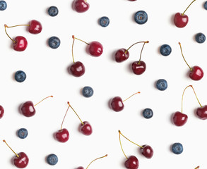 Cherries and blueberries on the white background, seamless pattern