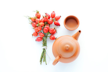 herbal tea with rose hips isolated on white, Medicinal plants and herbs composition