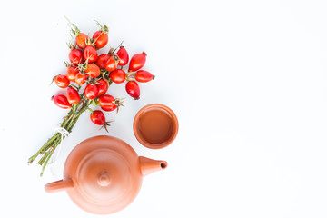 herbal tea with rose hips isolated on white, Medicinal plants and herbs composition