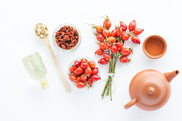 herbal tea with rose hips isolated on white, Medicinal plants and herbs composition