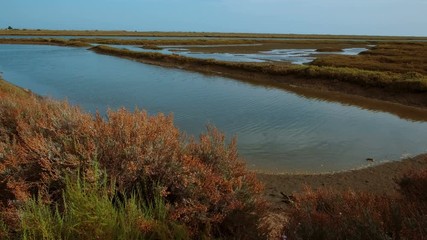 Tracking shot of the stunning Ria Formosa lagoon, in The Algarve, Portugal a system of barrier islands connected with the sea