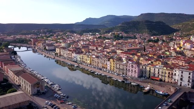 Bosa, Sardinia, Italy - Drone Aerial shot hovering over the river temo and two stone bridges. A perfect Italian landscape