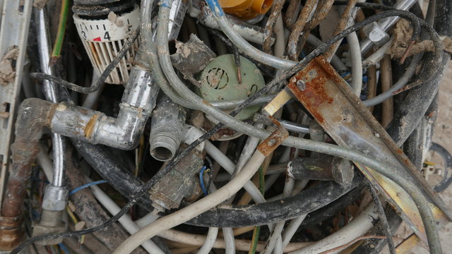  Scrap and old rusty metal waste, residual waste from the house demolition, ready for transport and recycling.