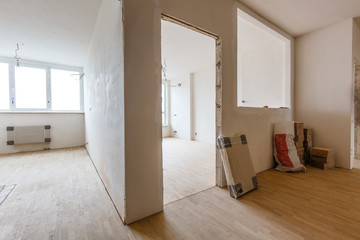 Empty room, flat with ceiling , parquet floor and white walls