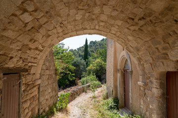medieval arch in the alleys french village in Provence Oppede le Vieux