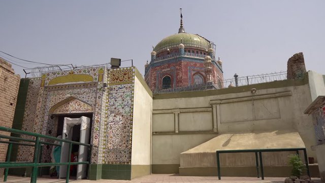 Multan Hazrat Shah Shams Sabzwari Shrine Muslim Women with Head Scarf are Entering the Mausoleum on a Sunny Blue Sky Day