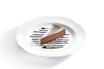 Macro Shot of Chocolate Cheesecake on White Plate Isolated