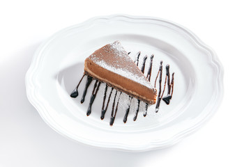 Macro Shot of Chocolate Cheesecake on White Plate Isolated
