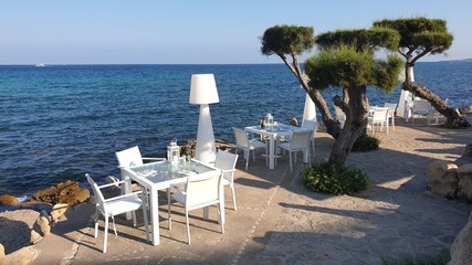 beach with chairs and umbrellas