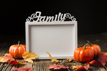 Halloween pumpkins with leaves and mock-up frame