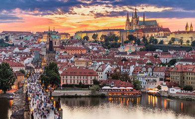 Prague - Czech Republic - Sunset or sunrise view of Charles Bridge and Prague Castle over Vltava river and historical center of Prague, buildings and landmarks of old town 