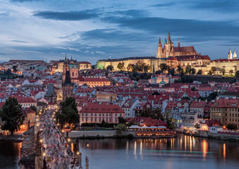 Fototapeta premium Prague - Czech Republic - Sunset or sunrise view of Charles Bridge and Prague Castle over Vltava river and historical center of Prague, buildings and landmarks of old town 