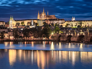 Fototapeta na wymiar Prague - Czech Republic - Sunset or sunrise view of Charles Bridge and Prague Castle over Vltava river and historical center of Prague, buildings and landmarks of old town 
