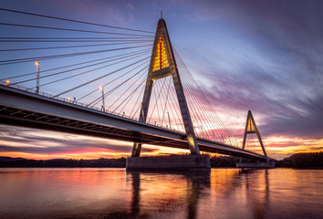 Fototapeta na wymiar Budapest - Hungary - Megyeri Bridge over River Danube at sunset with beautiful clouds and sky