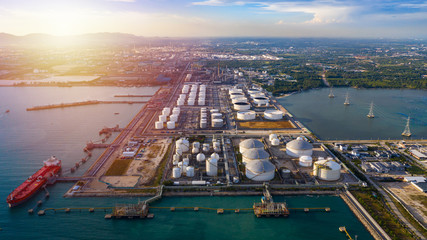 Aerial view tanker and oil storage tank  petrochemical oil shipping terminal. - obrazy, fototapety, plakaty