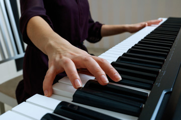 Young woman playing piano