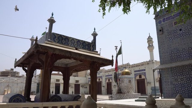 Multan Darbar Hazrat Yousaf Shah Gardez Tomb with Pavilion and Flying Birds Side View on a Sunny Blue Sky Day