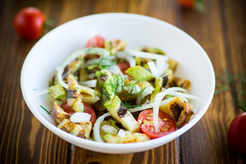 warm grilled zucchini salad with fresh cherry tomatoes and onions