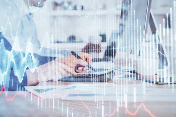 Forex graph with businessman working on computer in office on background. Concept of hardworking. Closeup. Multi exposure.