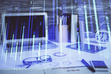 Double exposure of chart and financial info and work space with computer background. Concept of...