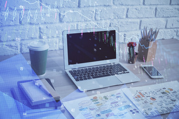 Double exposure of forex chart and work space with computer. Concept of international online trading.