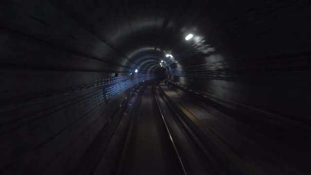 Real Time Metro Underground Train Driving Through Dark Tunnel
